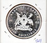 E5618 MONEDA UGANDA 1000 CHELINES 2002 BRONCE BAÑADA EN PLATA MBC - Imagen 2